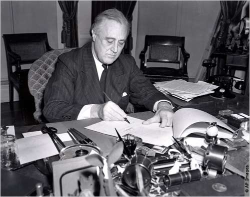 President Roosevelt signs the Lend-Lease bill to give aid to Britain and China in 1941