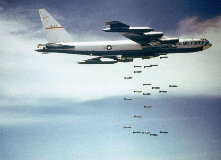 A U.S. Air Force Boeing B-52F-70-BW Stratofortress (s/n 57-0162, nicknamed "Casper The Friendly Ghost") from the 320th Bomb Wing dropping Mk 117 750 lb (340 kg) bombs over Vietnam. 1965-1966