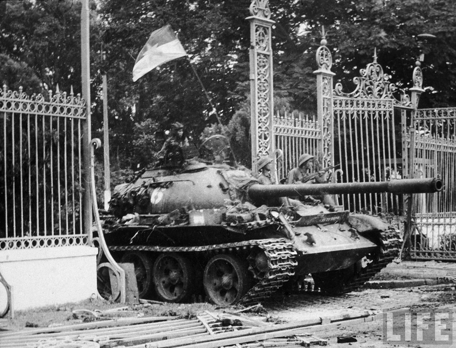 North Vietnamese soldiers riding atop a T-54 tank crashing through the gates of the Presidential Palace during the fall of Saigon April 30th, 1975
