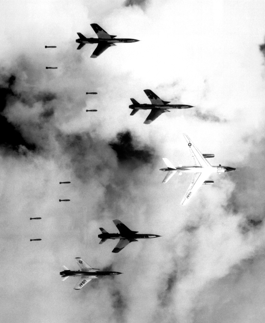 USAF Republic F-105 Thunderchief fighter bombers flying under radar control with a Douglas B-66 Destroyer bomb a military target through low clouds over the southern panhandle of North Vietnam on June 14th, 1966 (Photo Source: US Department of Defence)