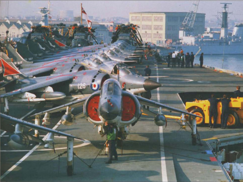The carrier deck of HMS Hermes crowded with Royal Navy Sea Harriers in 1982
