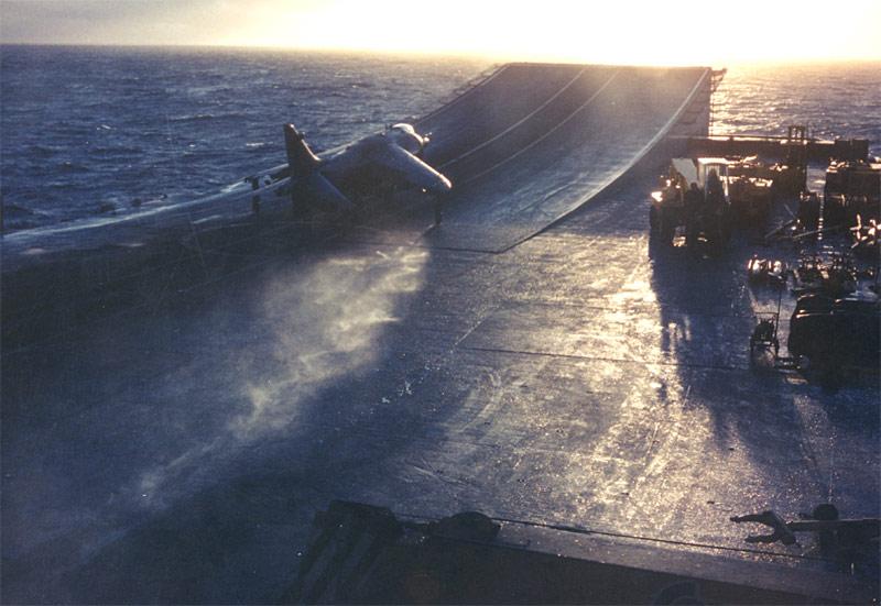 A Royal Navy Sea Harrier prepares to take off on the ski-jump of HMS Hermes off the Falkland Islands in 1982 