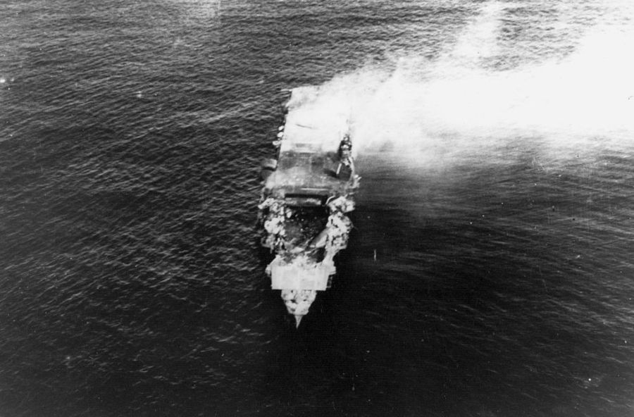 The burning Japanese aircraft carrier Hiryu, photographed by a plane from the carrier Hosho shortly after sunrise on 5 June 1942. Hiryu sank a few hours later. Note collapsed flight deck over the forward hangar Midway 1942