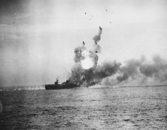 A Kamikaze aircraft strikes the USS St. Lo causing an enormous fireball during the battle of Leyte Gulf 1944 resulting in this becoming the first major warship sunk by a Kamikaze attack 