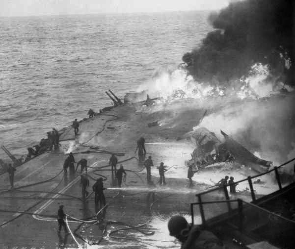 The deck of the USS Saratoga (CV-3) in flames following a hit by a Kamikaze aircraft on February 21st, 1945 (Photo Source: US Navy)