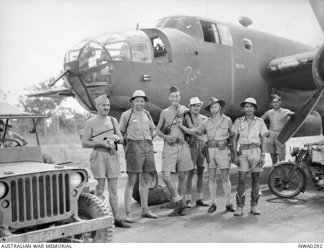 Personnel and aircrew of No. 18 Squadron, Netherlands East Indies (NEI), RAAF, in front of their North American B-25 Mitchell bomber, (aircraft number N5-131), named "Pulk", after returning from a raid against the Japanese - May 4th, 1943